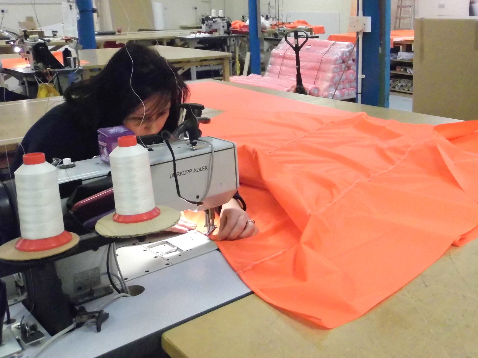 Panels being stitched on an industrial sewing machine in the UK workshop